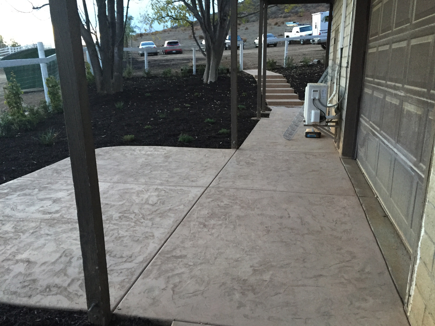 Colored concrete patio and steps in Winchester McCabe's Landscape Construction