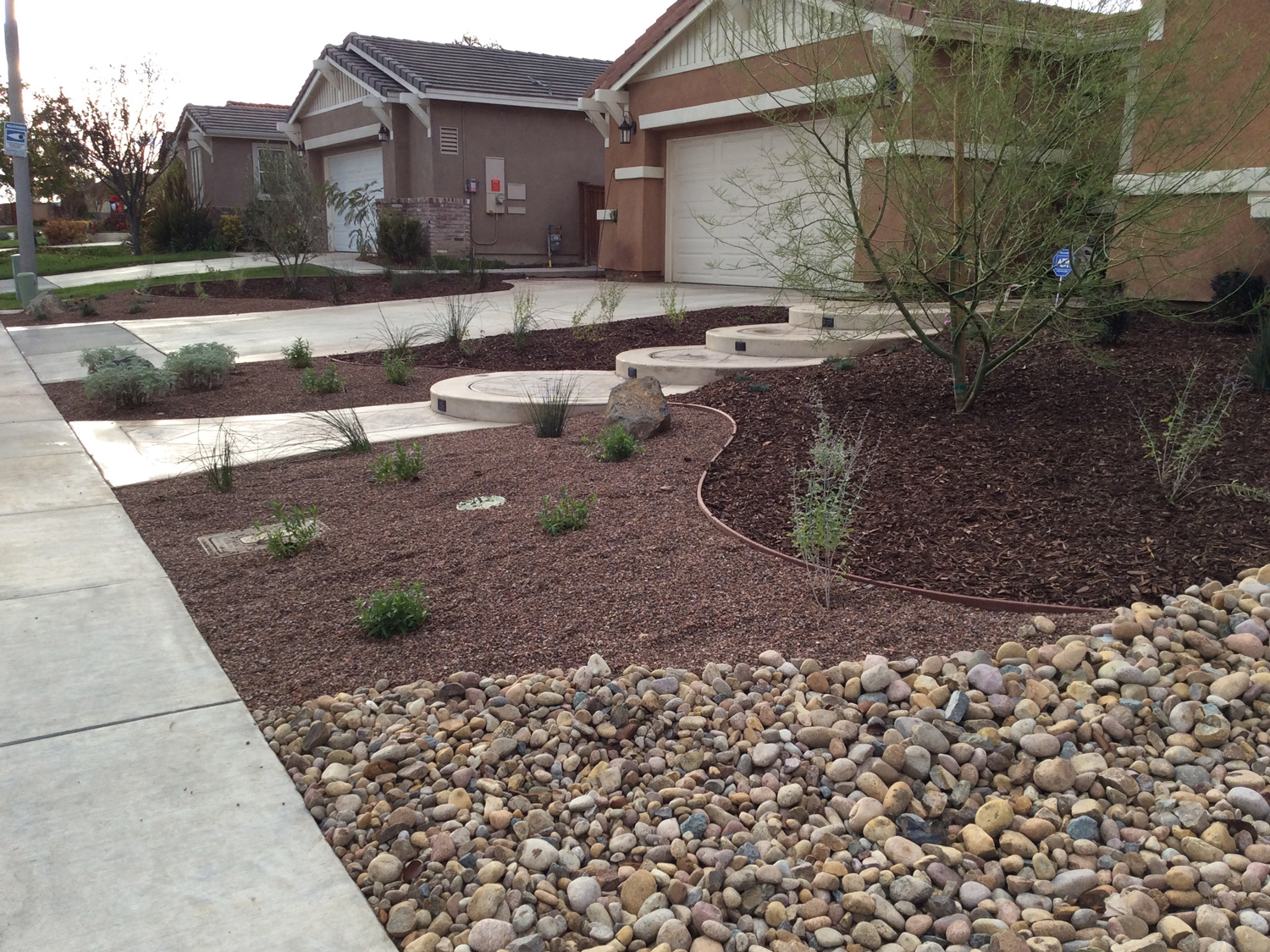 Gravel front yard and dry river stream bed in Murrieta McCabe's Landscape Construction
