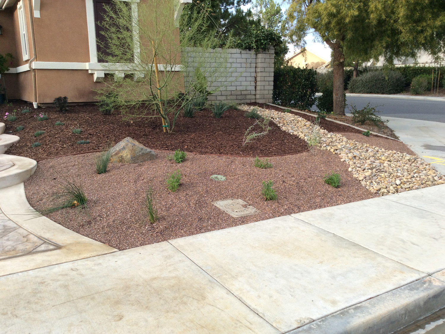 Dry River bed with gravel front yard in Murrieta McCabe's Landscape Construction