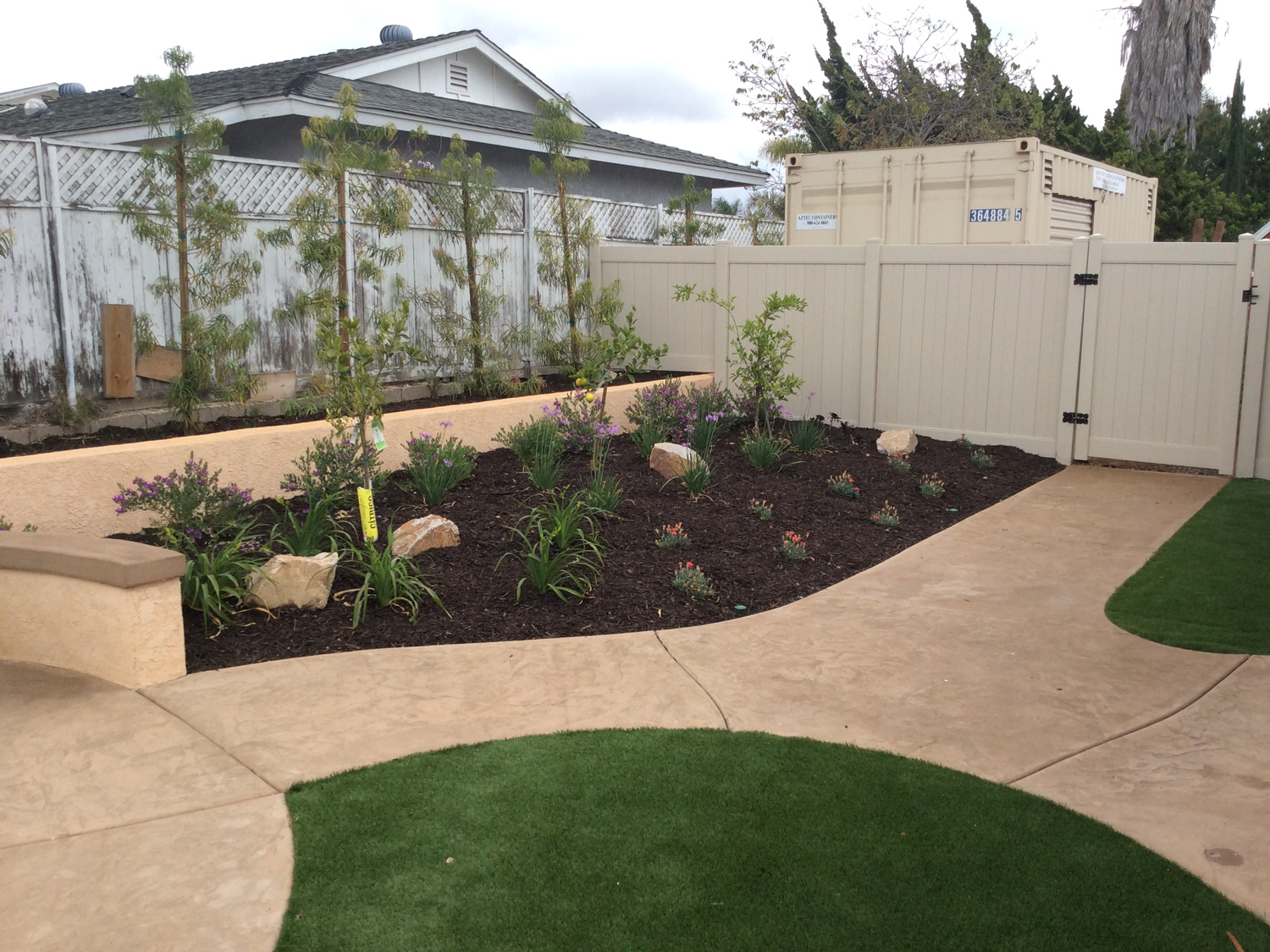 Concrete pathways and artificial turf in Oceanside McCabe's Landscape Construction