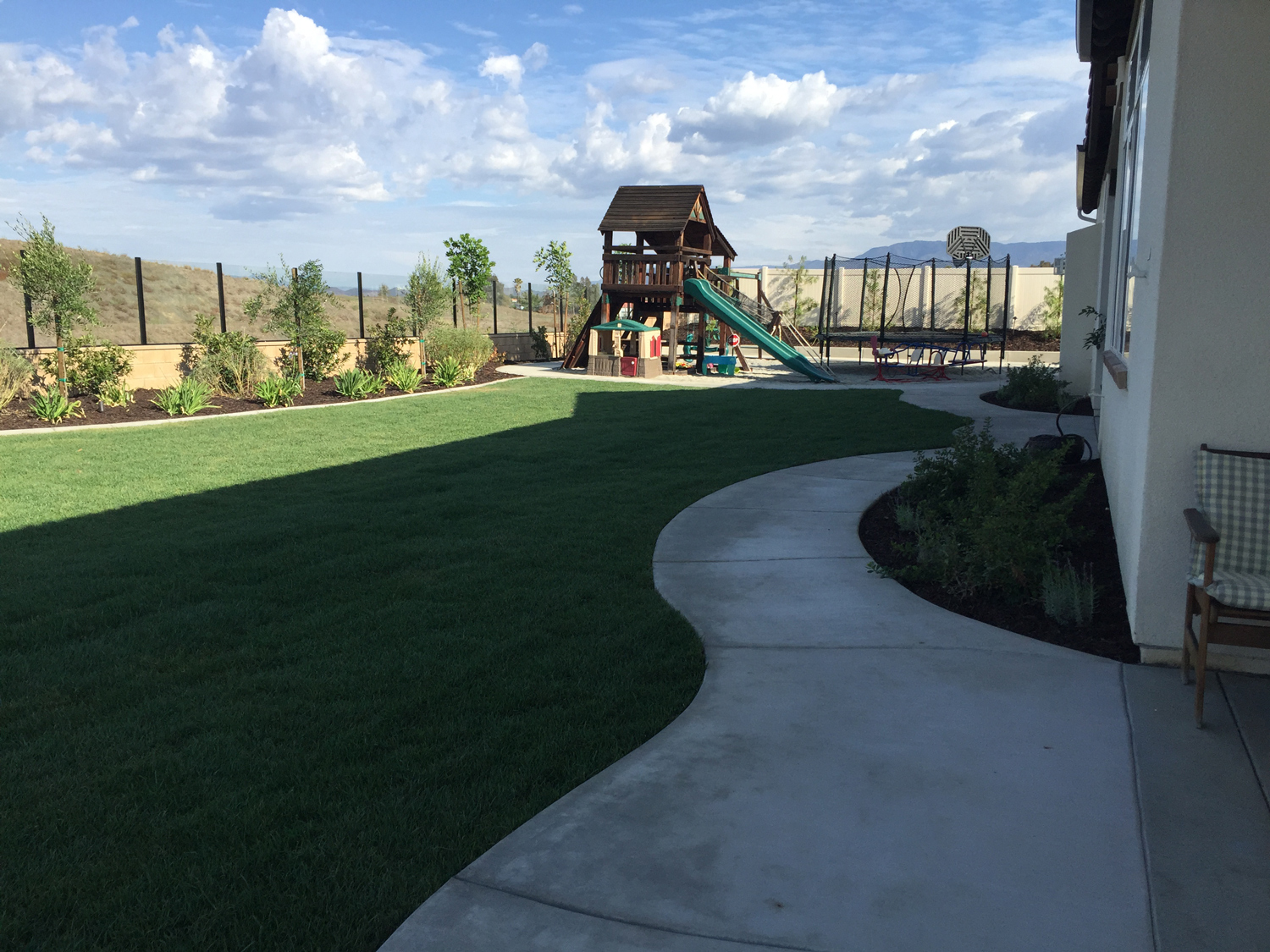 Rear grass with playground in Temecula McCabe's Landscape Construction