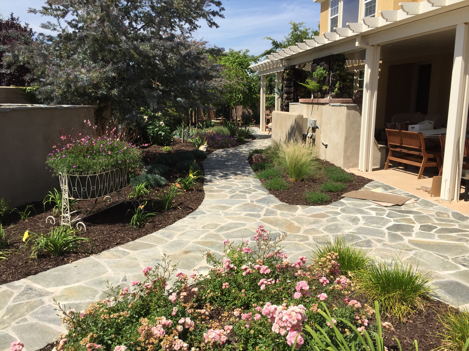 Flagstone pathways in cottage garden with patio cover in Temecula McCabe's Landscape Construction