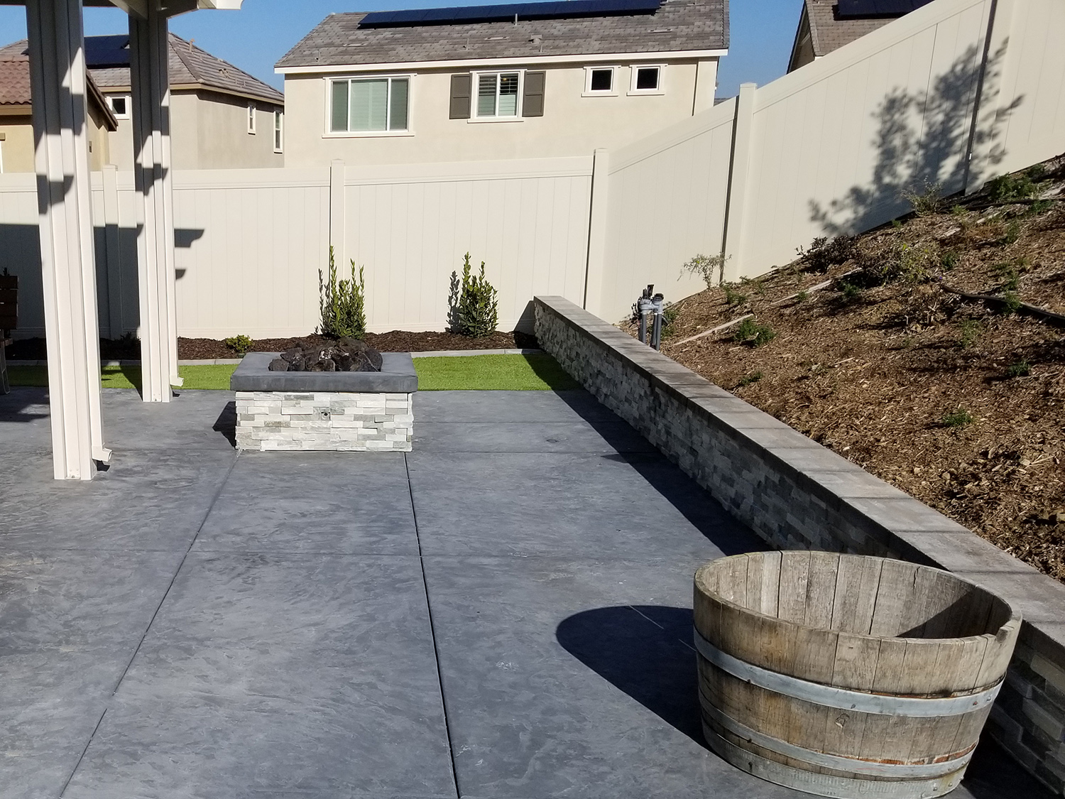 Concrete, fire pit and patio cover