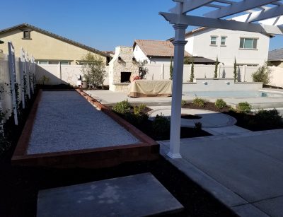 Bocce ball court with fireplace and concrete