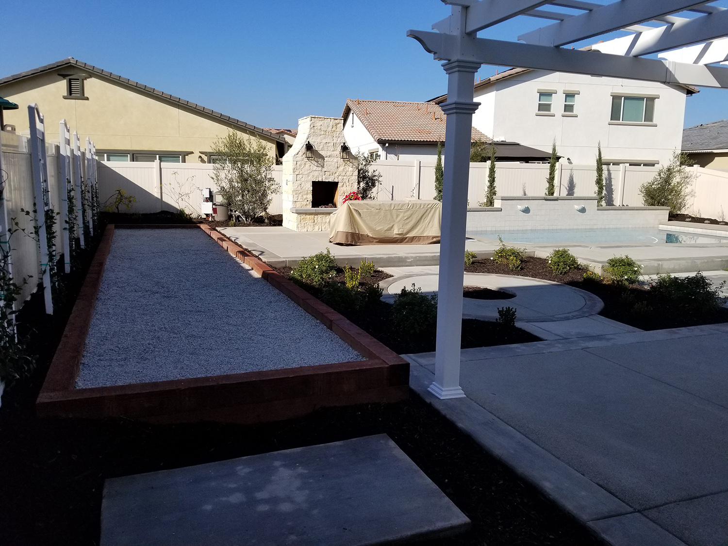 Bocce ball court with fireplace and concrete