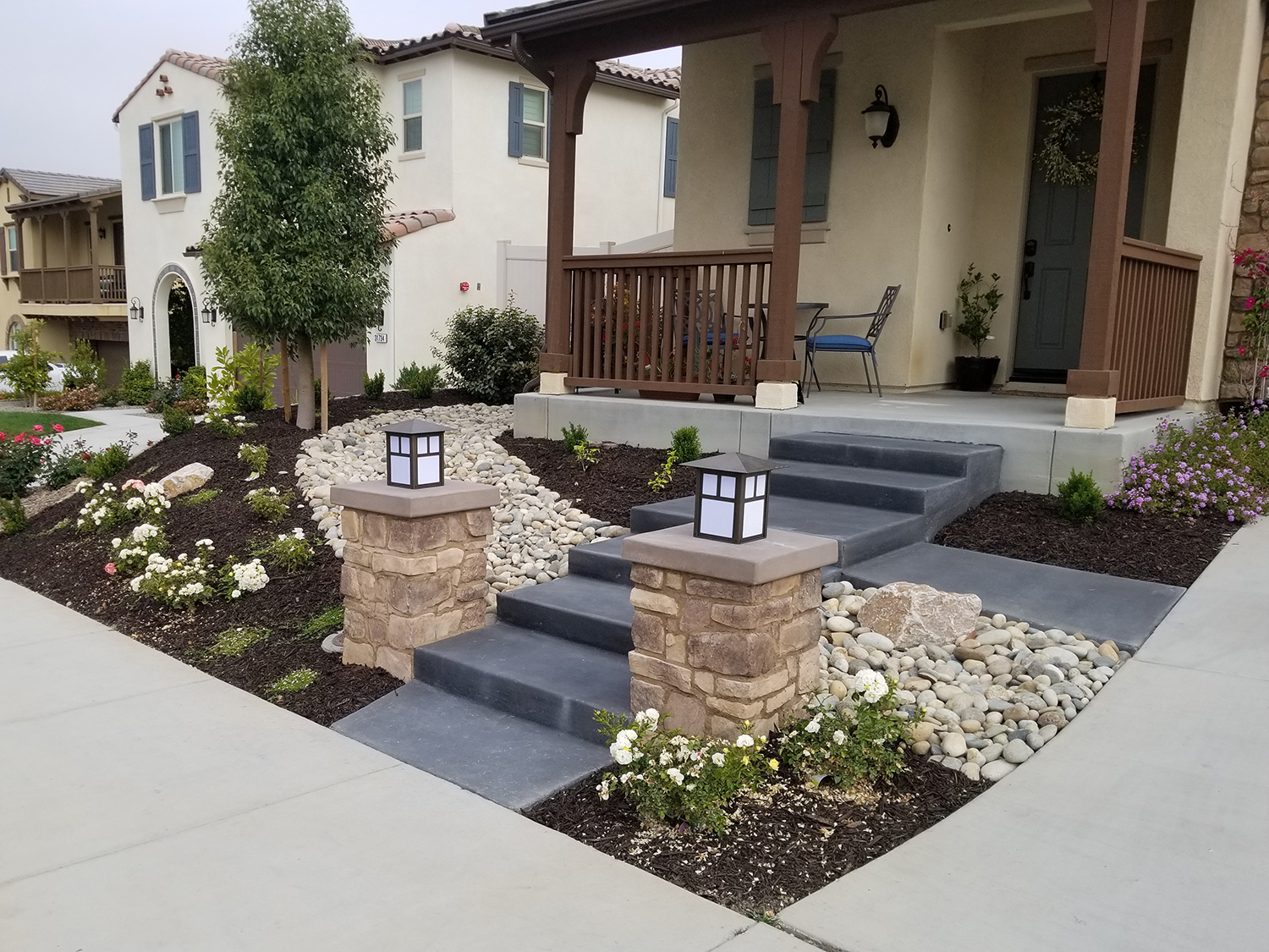 Front steps, pilasters, dry river bed