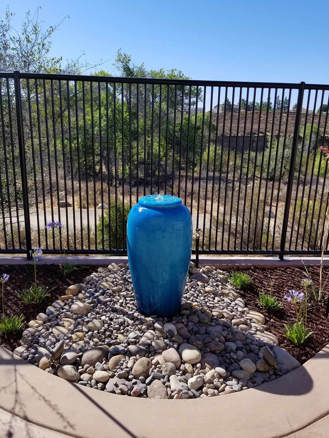 A colorful single pot water feature