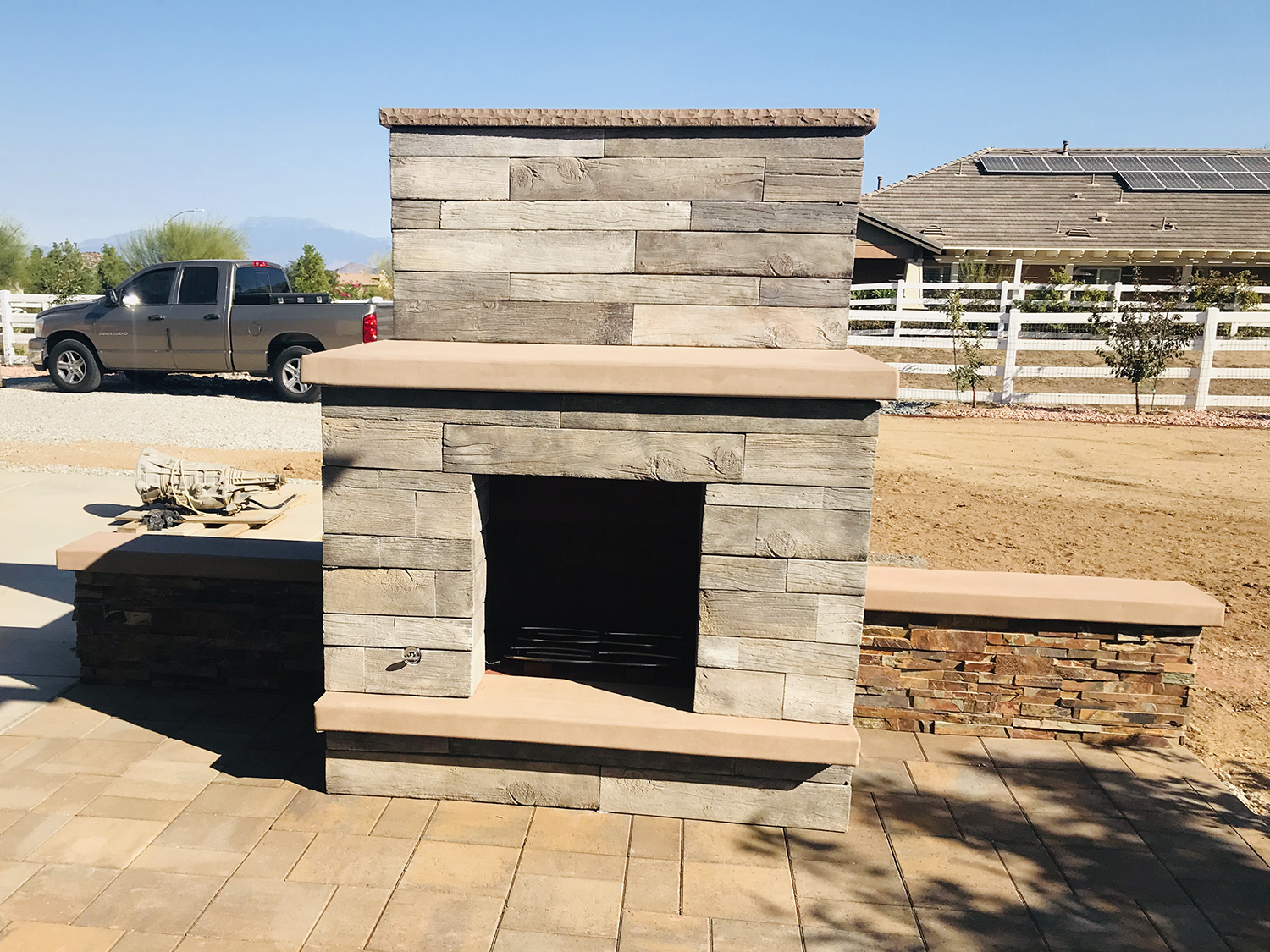 Wood faced outdoor fireplace