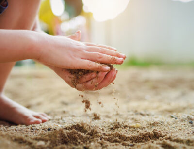 child playing in sand