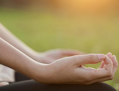 Young Woman doing Yoga Exercises Outdoor